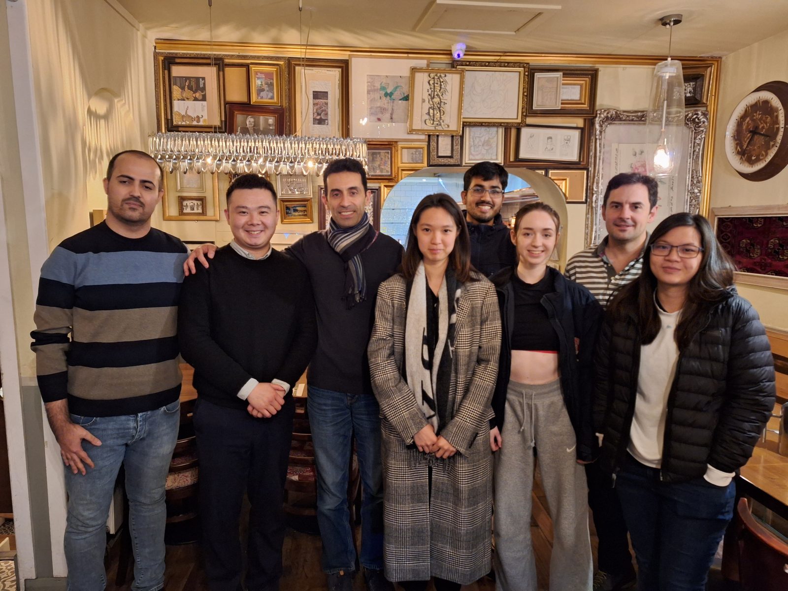 The HEAD Lab group standing together in a restaurant for the 2023 Christmas dinner.